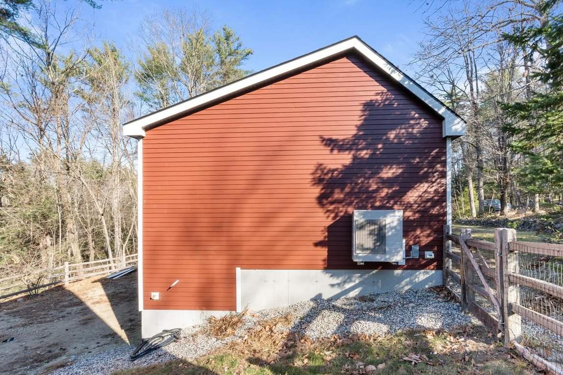 The same gable end after the addition, chimney removed and new siding run clean