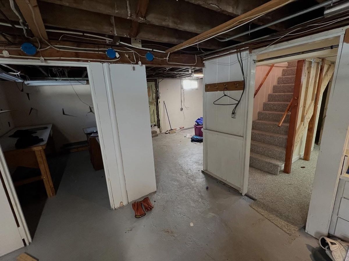 Original stair landing and partition walls before work began