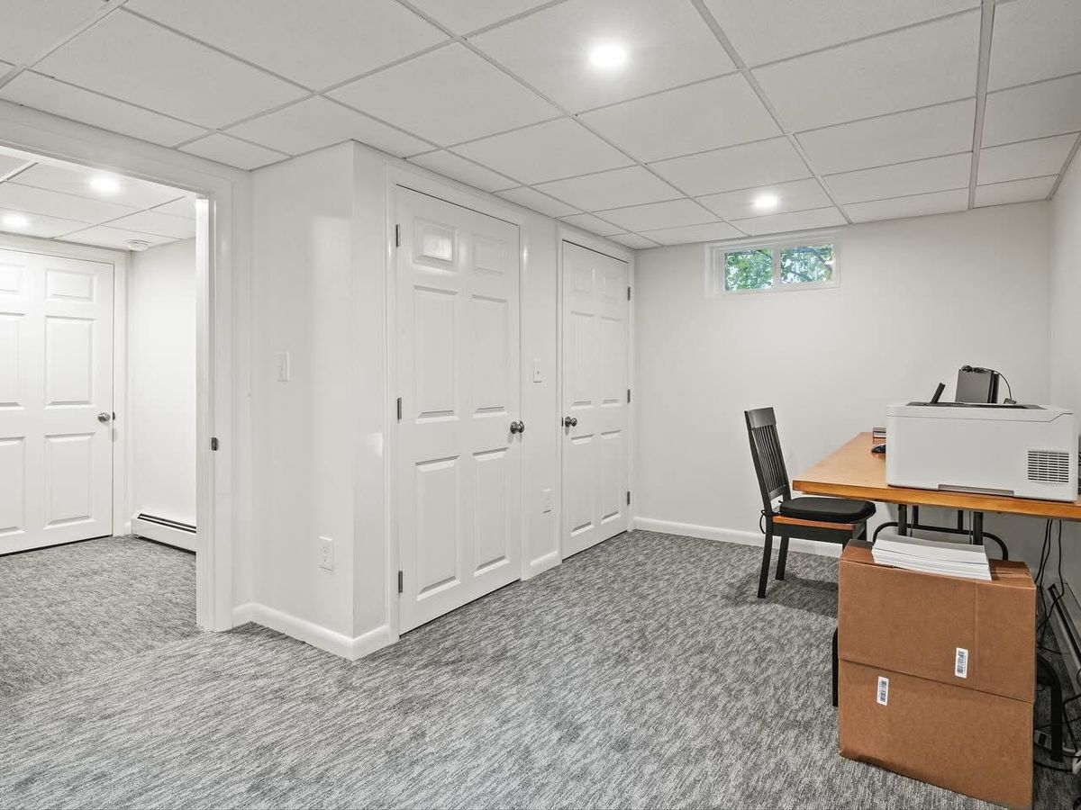 Finished office with double closets and natural light