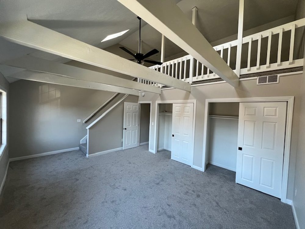 Restored great room with loft and built-in closets