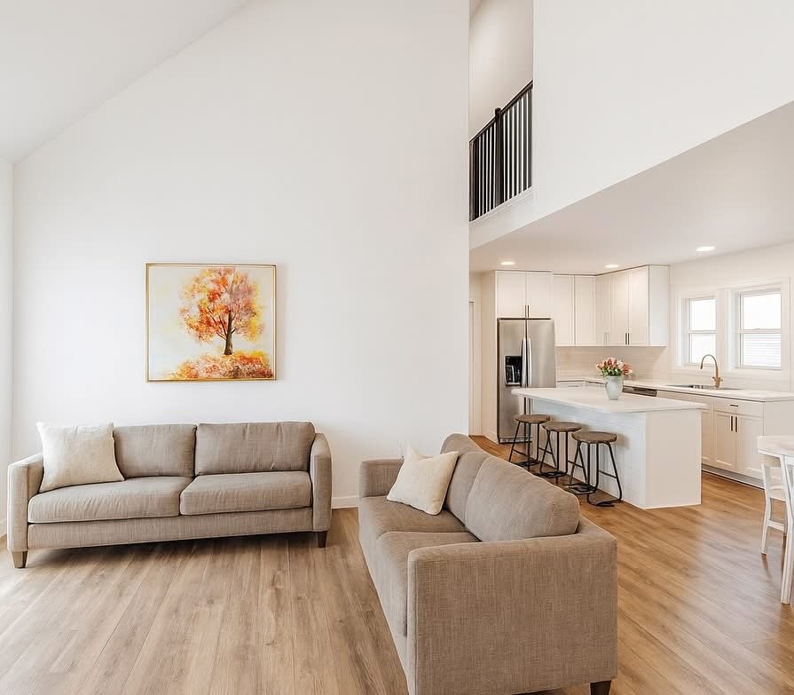 The Ellie &mdash; open living space with vaulted ceiling and loft above