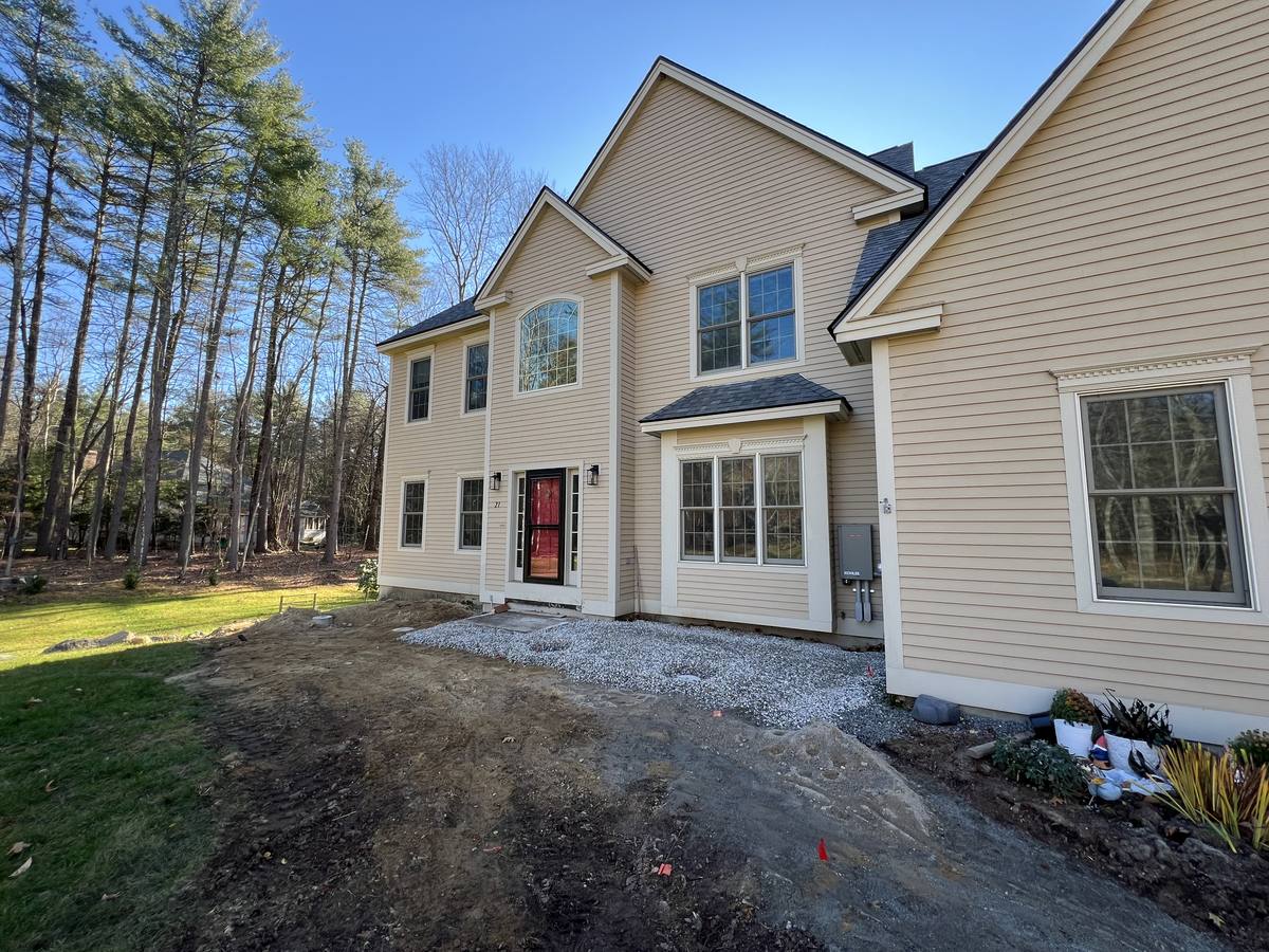 The entry and bay window before the porch, foundation still at bare grade