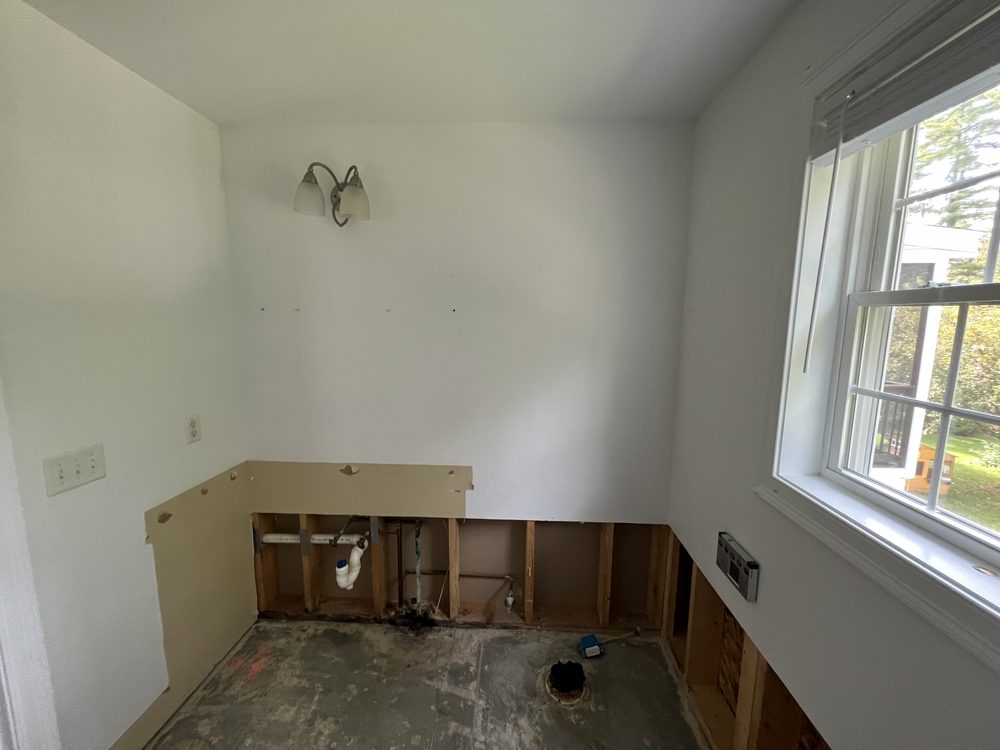 Bathroom stripped to studs after water damage